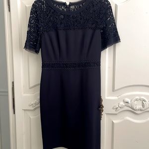 Dark Blue dress with lace top and waist band. Above the knee length. Like new!